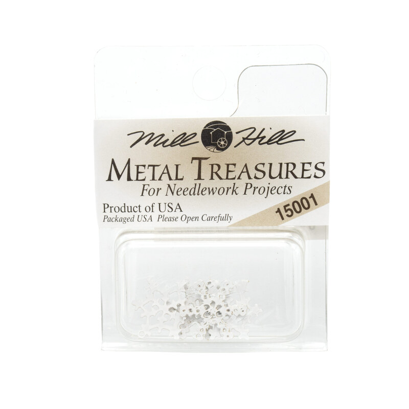 A package of four Snowflake charms by Mill Hill Metal Treasures in the color white.