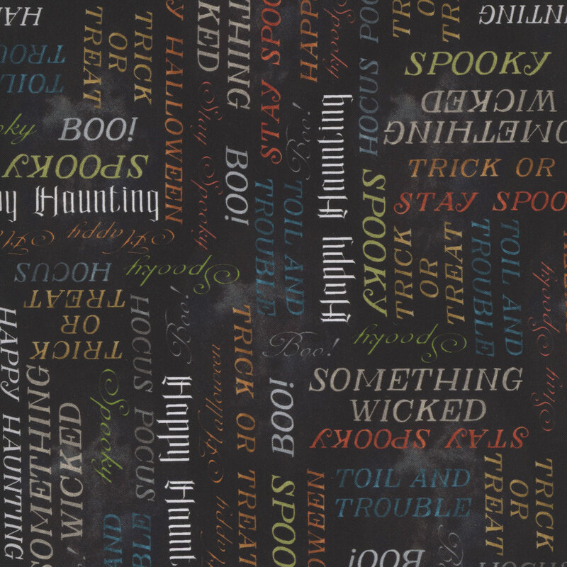 Multicolored Halloween-themed words and phrases on a mottled black background.