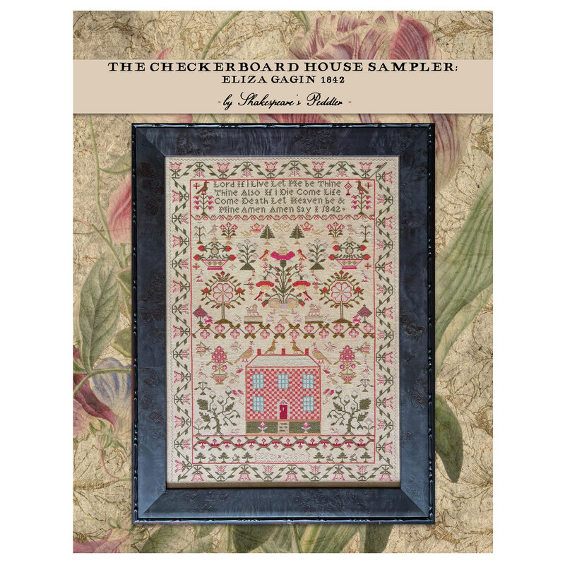 Front of pattern showing the completed cross stitch framed and staged with coordinating décor.