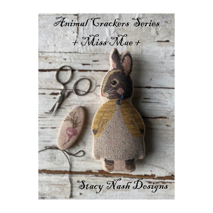 Front image of the Animal Crackers Series - Maggie Mae featuring the finished project rabbit and needle keep.