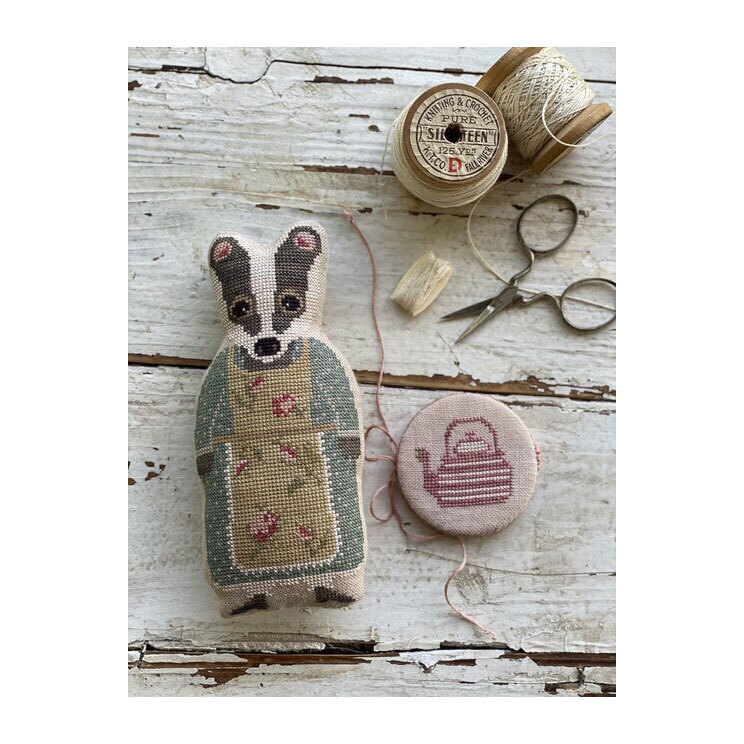 Front image of the Animal Crackers British Series - Clovis featuring the finished project badger and needle book.