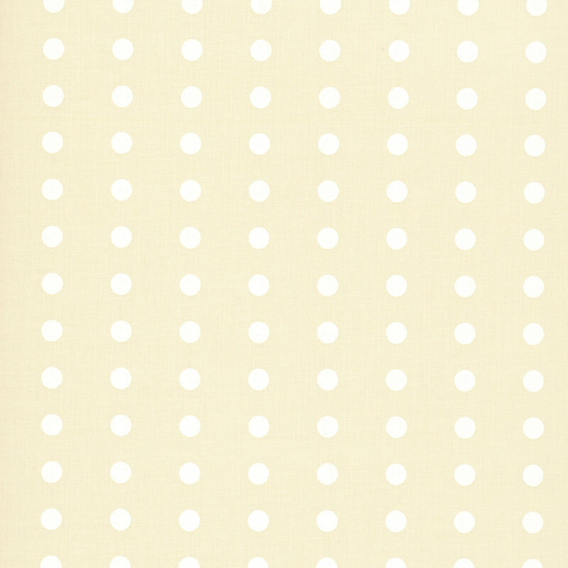 Cream fabric with a tonal white polka dot pattern.