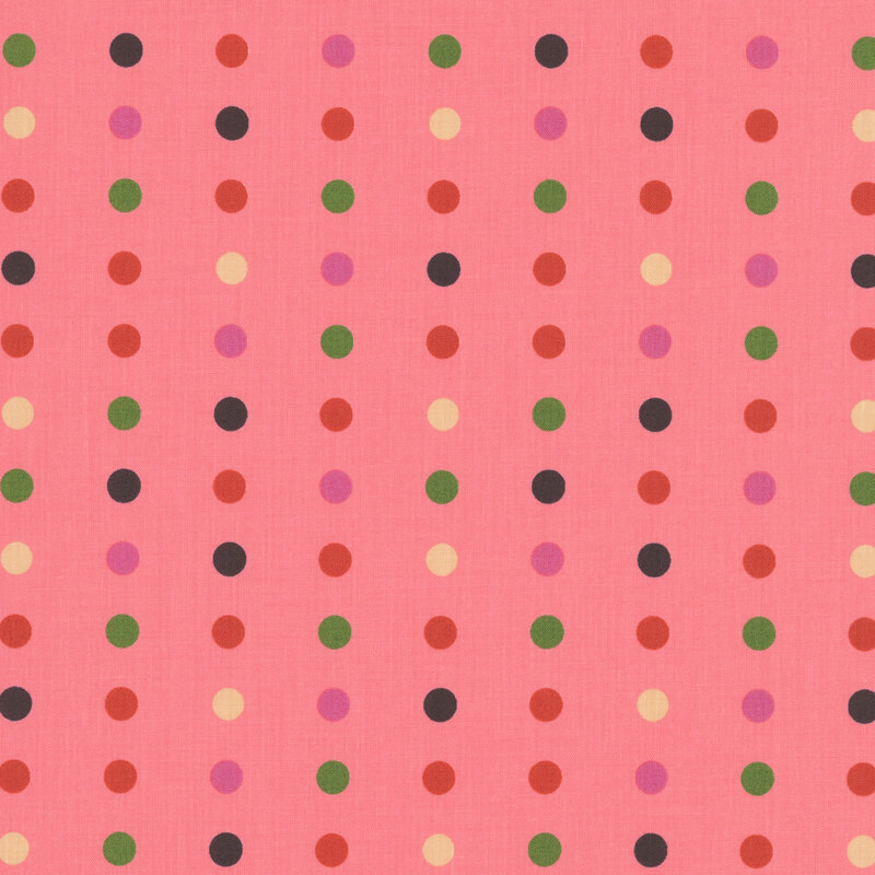 This pink fabric features a minimalist polka dot pattern.