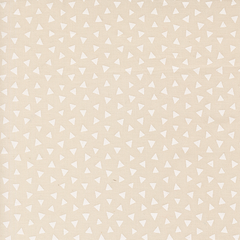 Light beige fabric featuring a tossed pattern of ivory triangles.