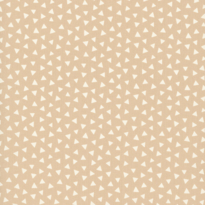 Light tan fabric featuring a tossed pattern of tonal triangles.
