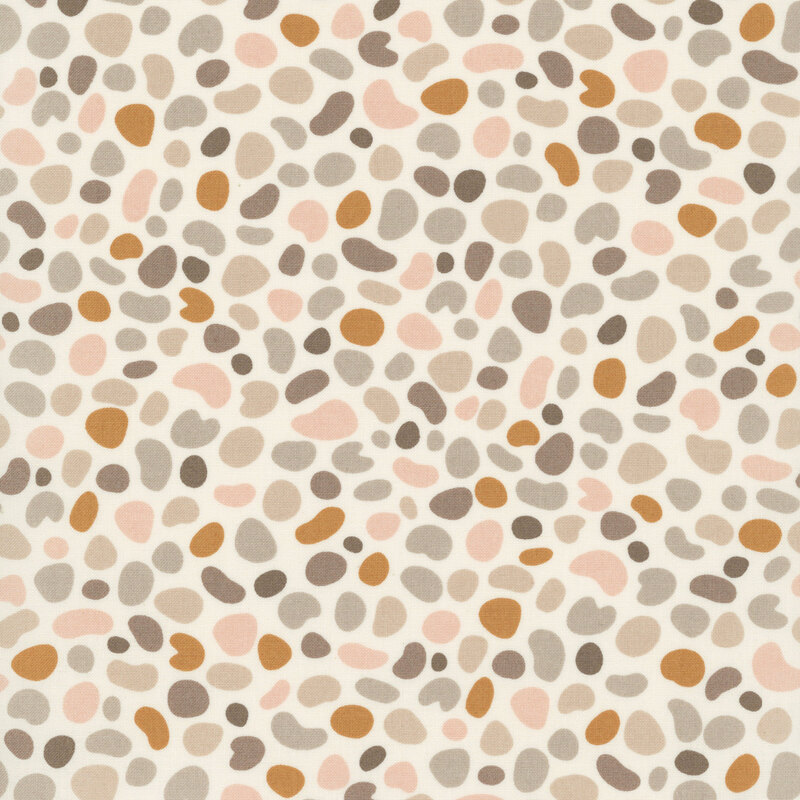Light beige fabric featuring pebble shaped motifs in hues of tan, taupe, mushroom, and blush.