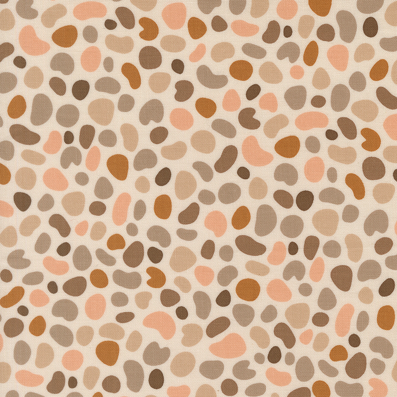 Light beige fabric featuring pebble shaped motifs in hues of tan, taupe, mushroom, and blush.
