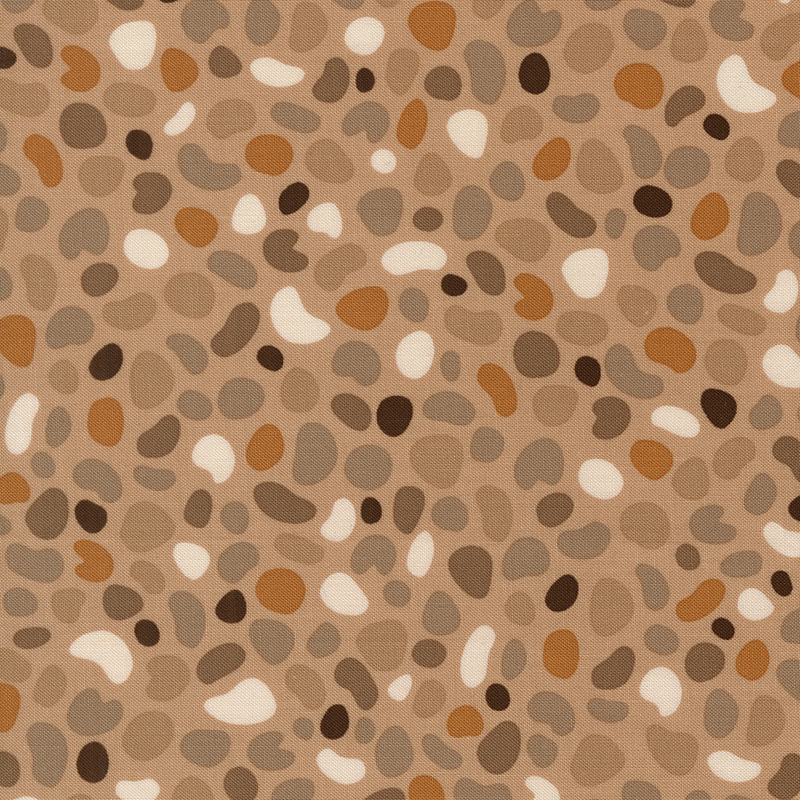 Taupe fabric featuring pebble shaped motifs in hues of tan, taupe, mushroom, dark brown, and ivory.