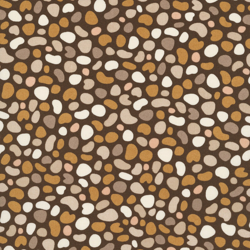 Dark brown fabric featuring pebble shaped motifs in hues of tan, taupe, mushroom, blush, and ivory.