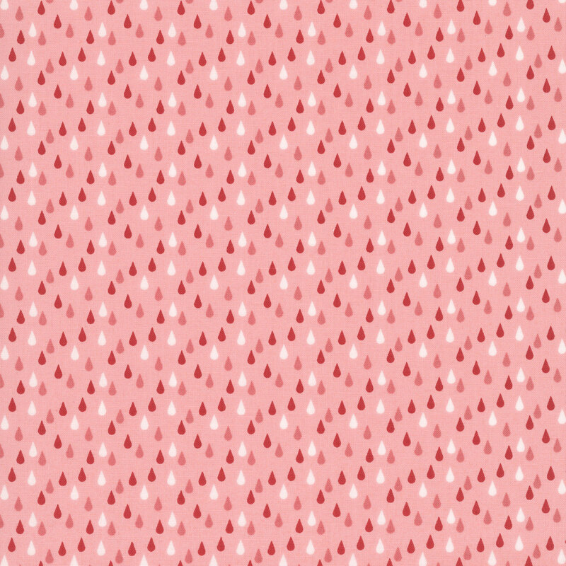This salmon pink fabric features red, pink and white rain drops. 