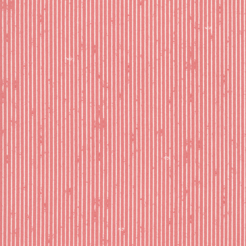 This salmon pink fabric features rustic white pin stripes. 