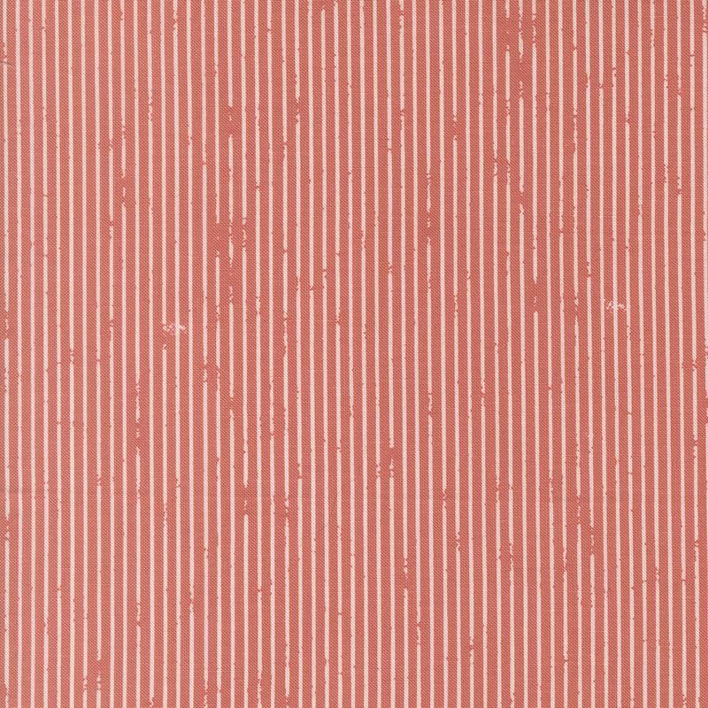 This salmon pink fabric features rustic white pin stripes. 