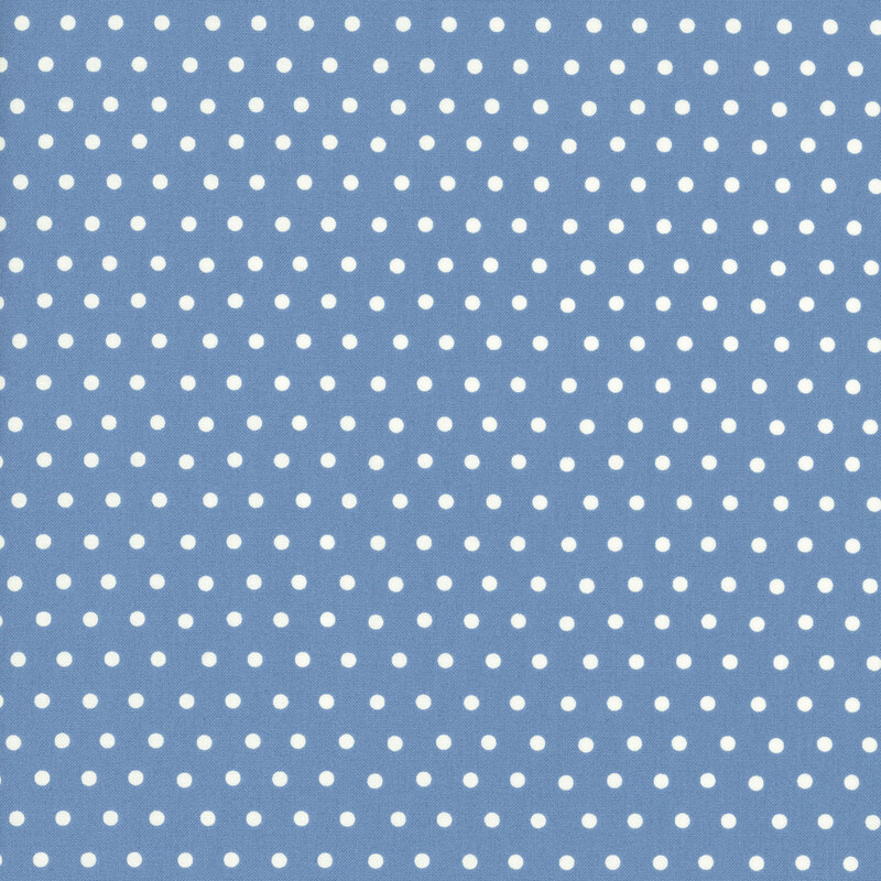 Denim blue fabric with a white polka dot pattern.