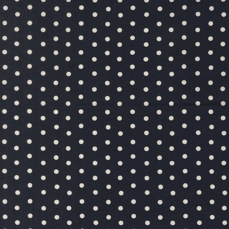 Dark navy fabric with a white polka dot pattern.