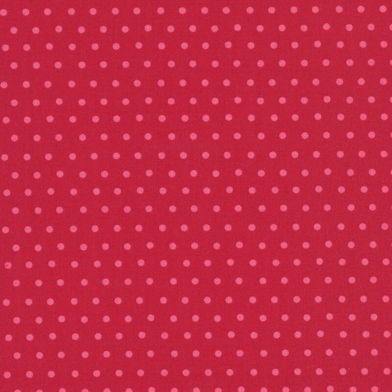 Dark red fabric with a watermelon red polka dot pattern.