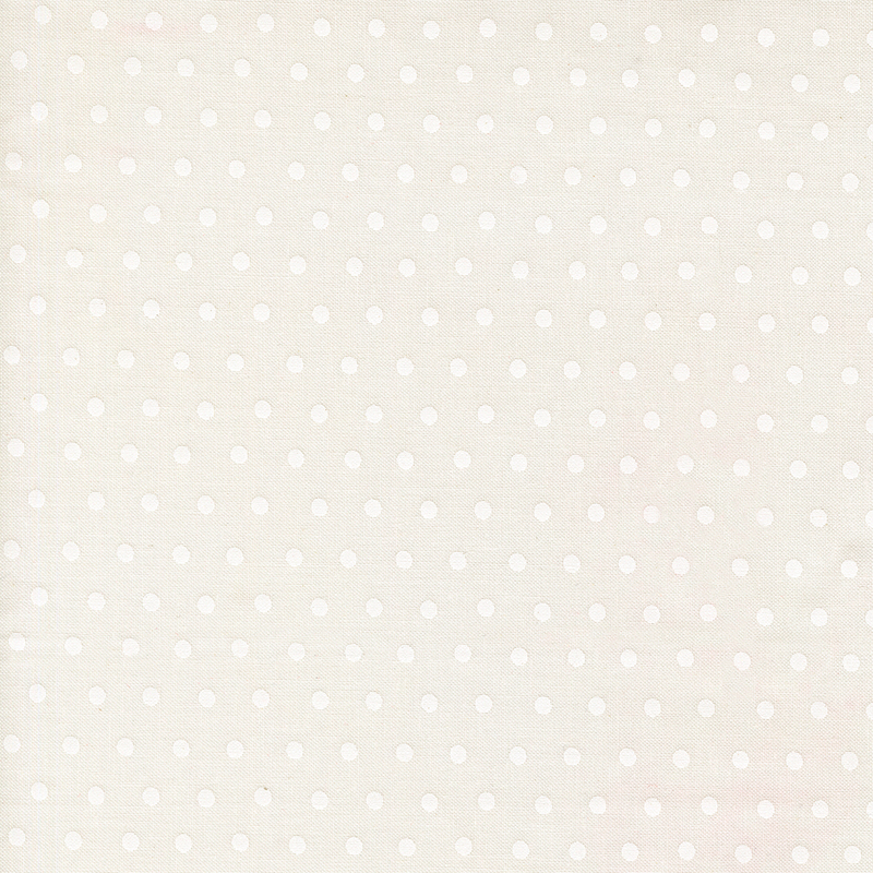 Snow white fabric with a white polka dot pattern.