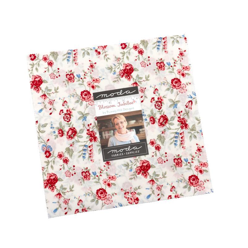 The Blossom Jubilee Layer Cake in its packaging, isolated on a white background.
