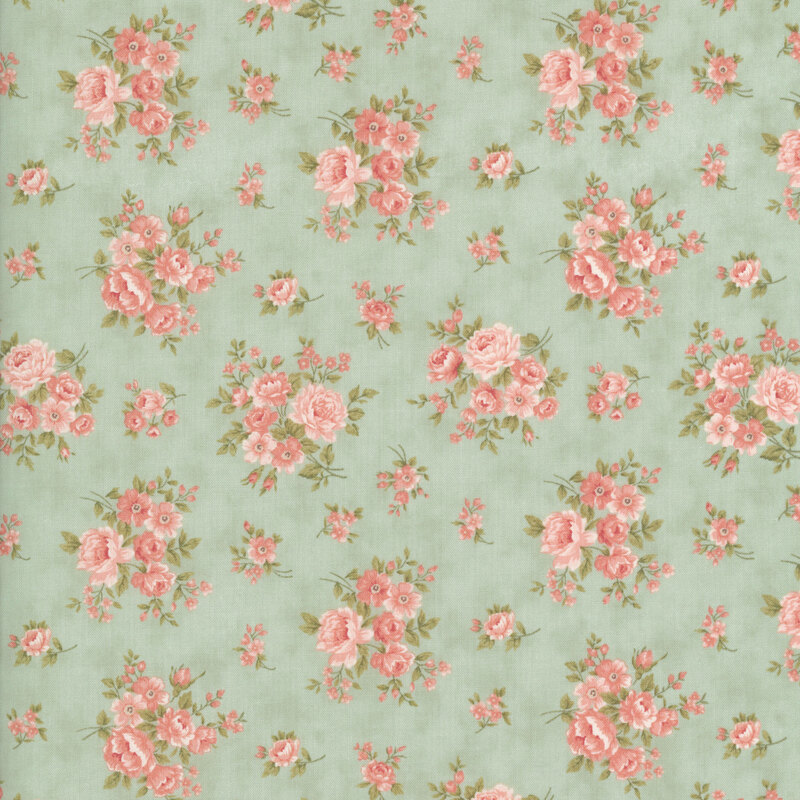 Pink and coral floral blossoms with olive leaves on a mottled misty blue green background.