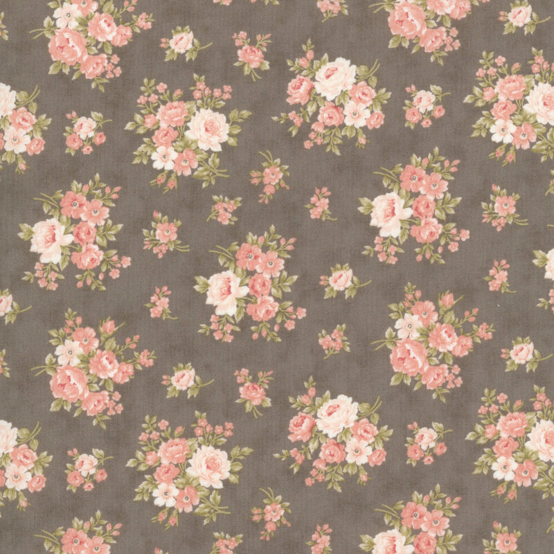 Pink and coral floral blossoms with olive leaves on a mottled dark taupe background.