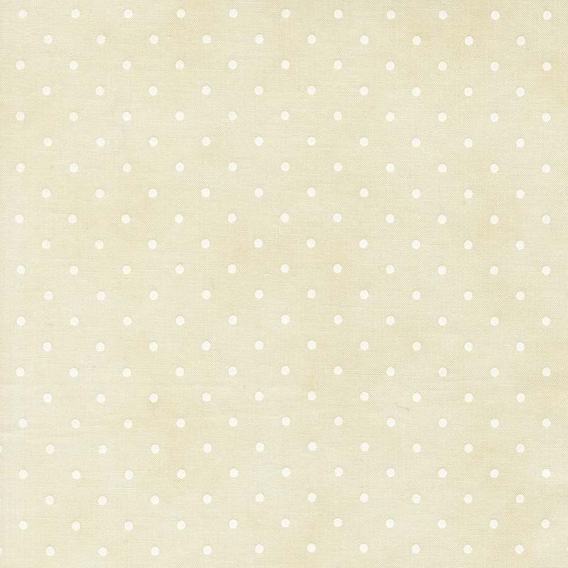 Polka dot print on a mottled cream background.