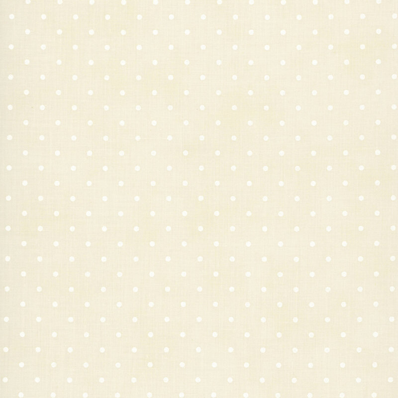Polka dot print on a mottled cream background.