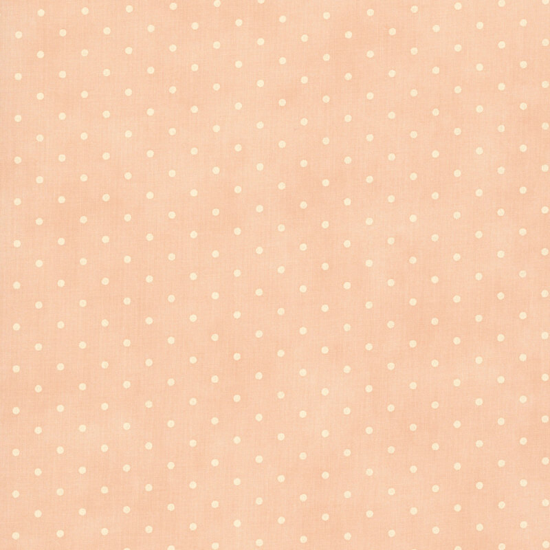 Tonal polka dot print on a mottled light peach background.