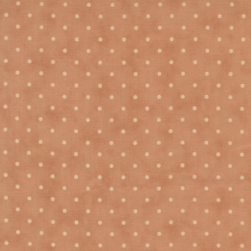 Tonal polka dot print on a mottled dark rose background.