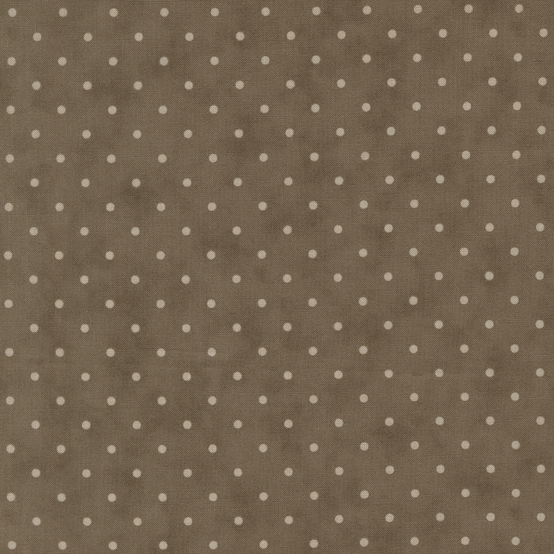 Tonal polka dot print on a mottled dark taupe background.