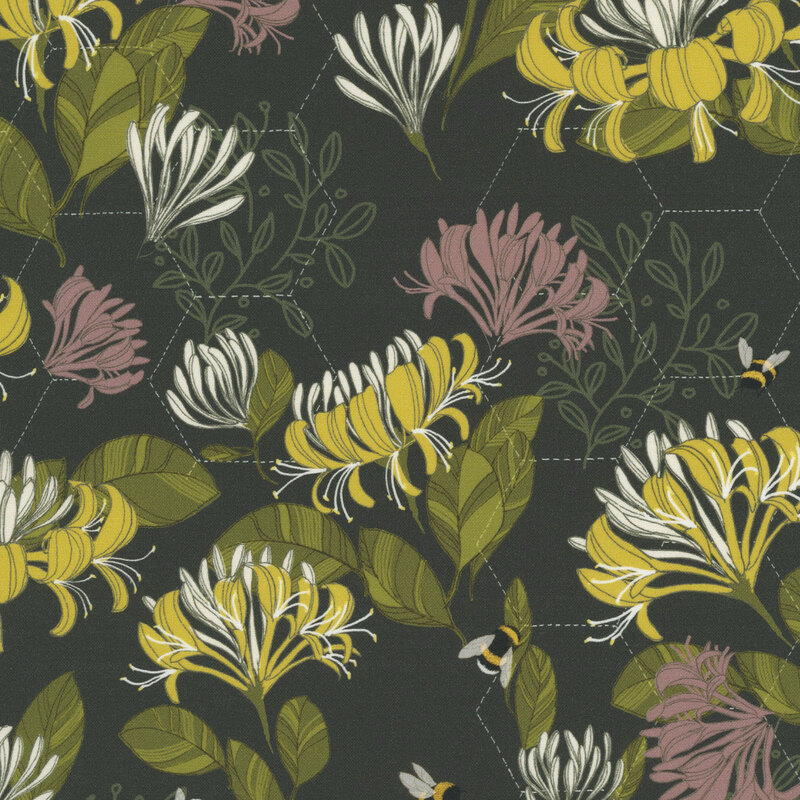 This black fabric features a honeycomb hexagon design layered beneath yellow and pink florals, with buzzing bees scattered throughout. 