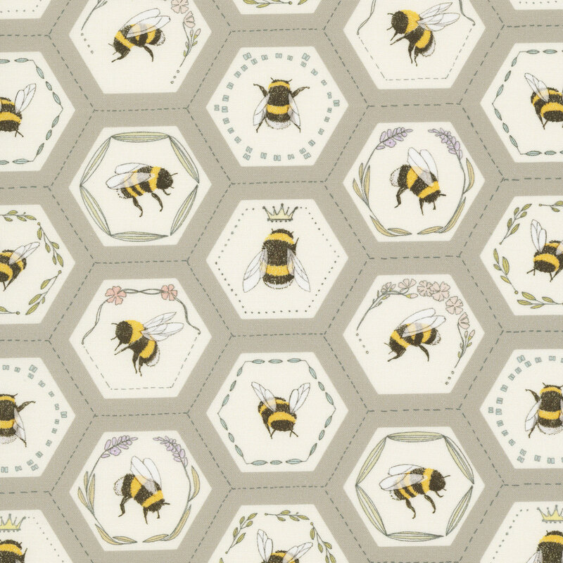 This mouse grey fabric features a honeycomb pattern filled with bee portraits, each adorned with floral accents, delicate crowns, and leafy wreaths.