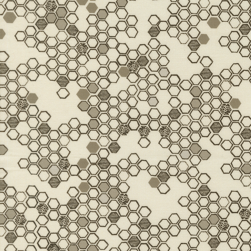 This cream fabric features a hand drawn design of black and grey hexagons. 
