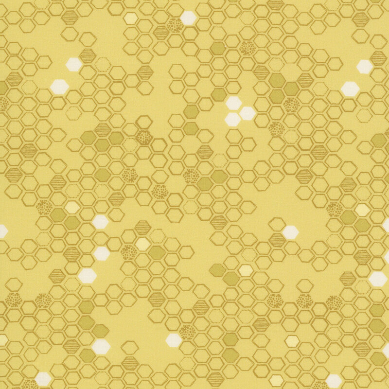 This butter yellow fabric features a hand drawn design of tonal hexagons. 