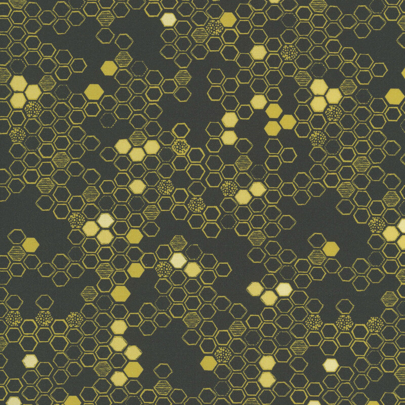 This black fabric features a hand drawn design of yellow hexagons. 