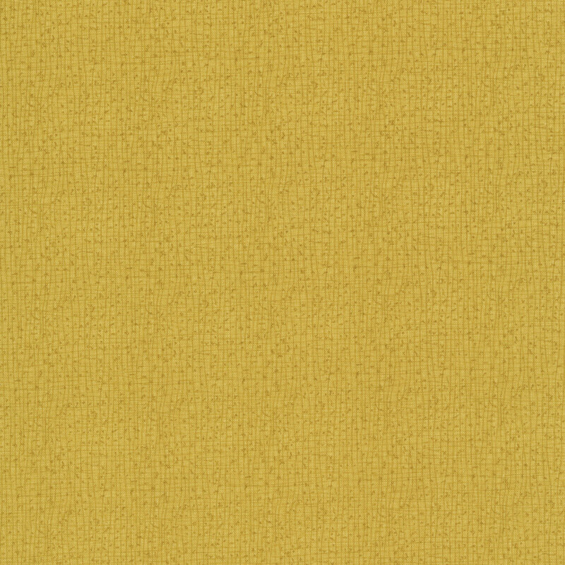 A close-up of a textured brassy yellow fabric with small, subtle weaves.