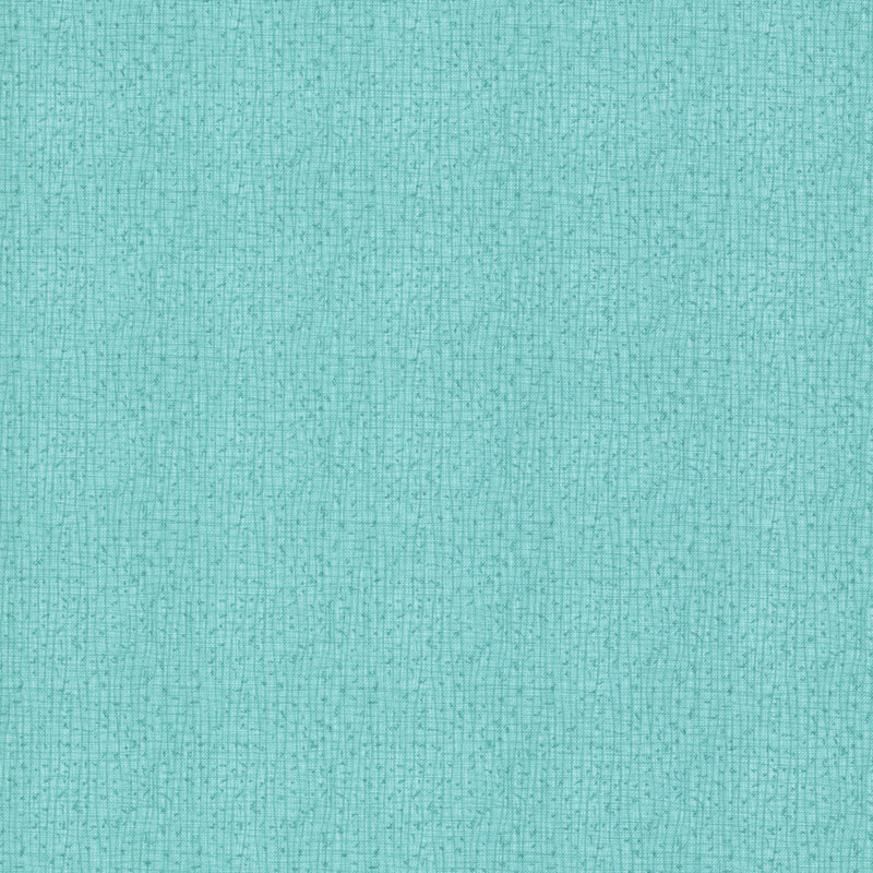 A close-up of a textured viridian fabric with small, subtle weaves.
