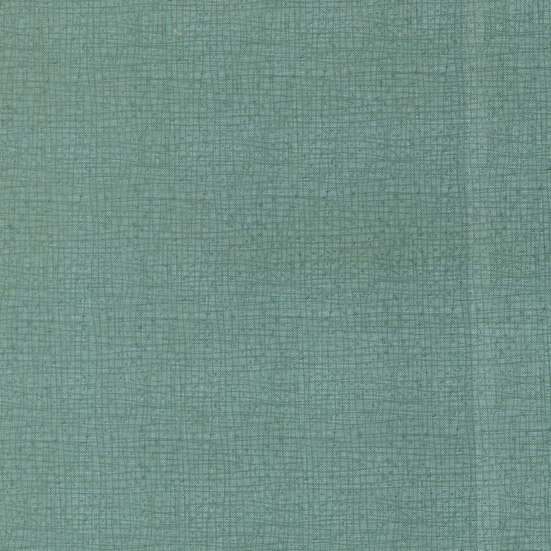 A close-up of a textured viridian fabric with small, subtle weaves.