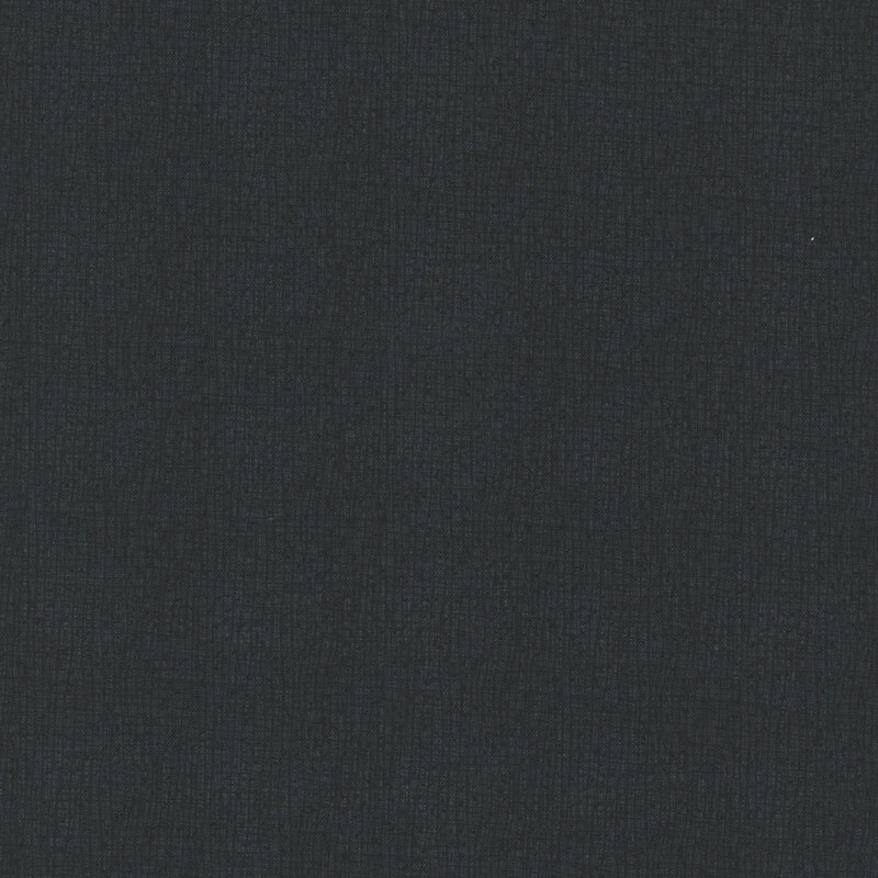 A close-up of a textured black fabric with small, subtle weaves.