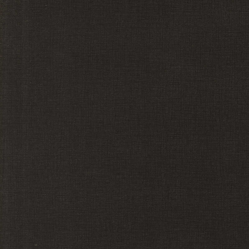 A close-up of a textured black fabric with small, subtle weaves.