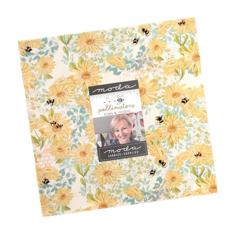 The Pollinators Layer Cake in its packaging, isolated on a white background.