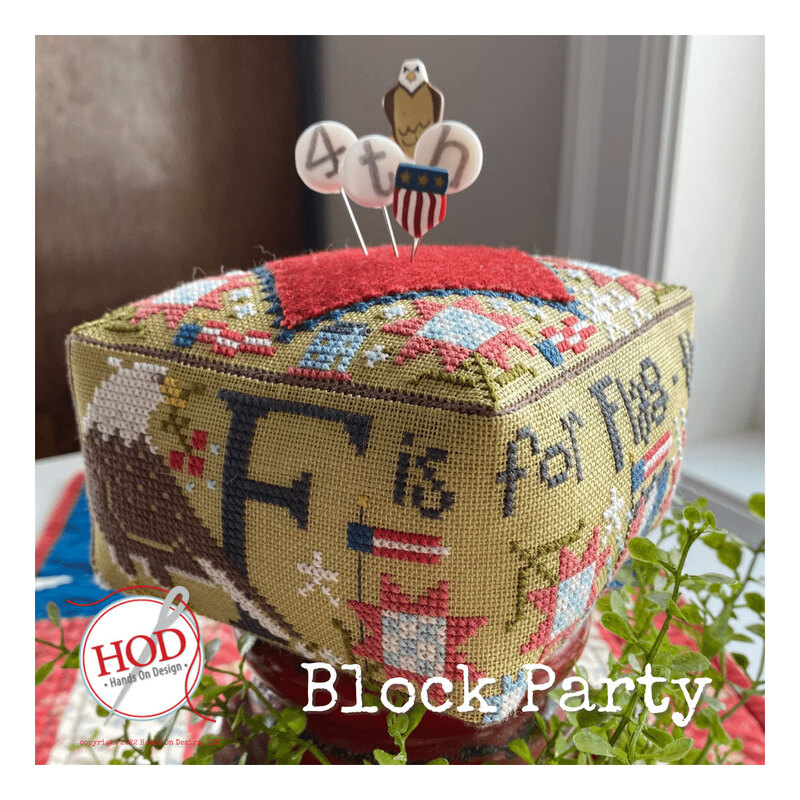 Image of the completed project featuring an eagle, F is for Flag, and a red wool square at the top with embellished pins sticking out.