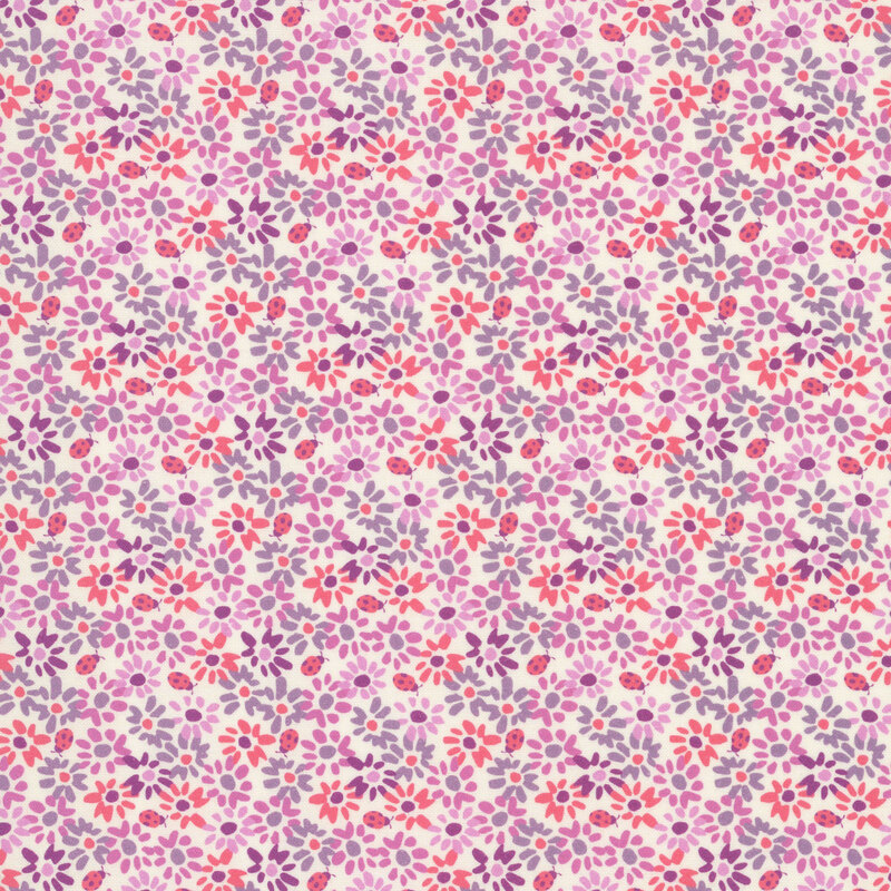 This cream fabric features densely packed flowers and lady bugs in shades of coral, mauve, and purple for a lush and vibrant floral design.