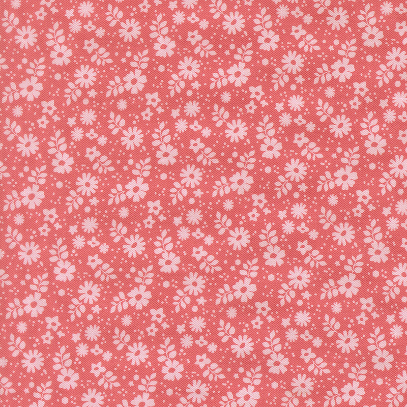This coral pink fabric features tossed pink florals.