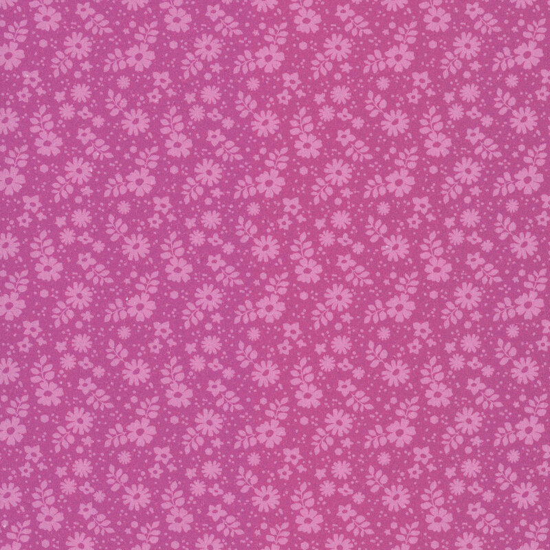 This tonal magenta fabric features tossed florals.