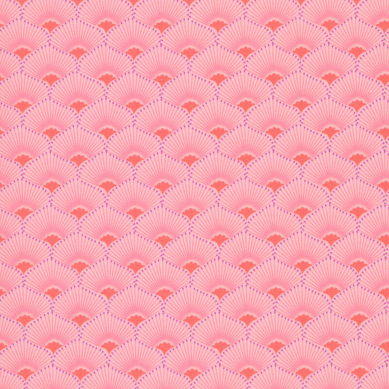 This coral pink fabric features a scalloped design highlighted by radiant orange centers and tonal rays. 