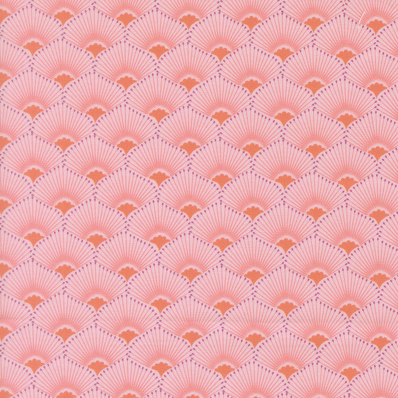 This coral pink fabric features a scalloped design highlighted by radiant orange centers and tonal rays. 