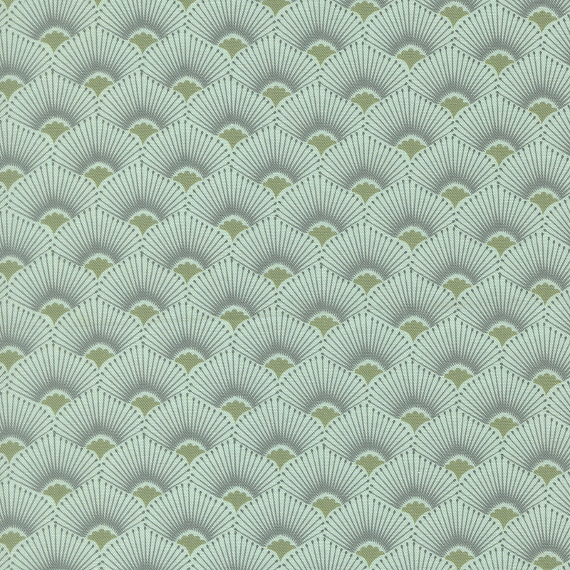This light teal fabric features a scalloped design highlighted by radiant sage green centers and muted blue rays. 