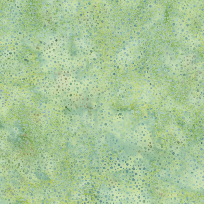 green fabric with a pattern of dots on a mottled background.
