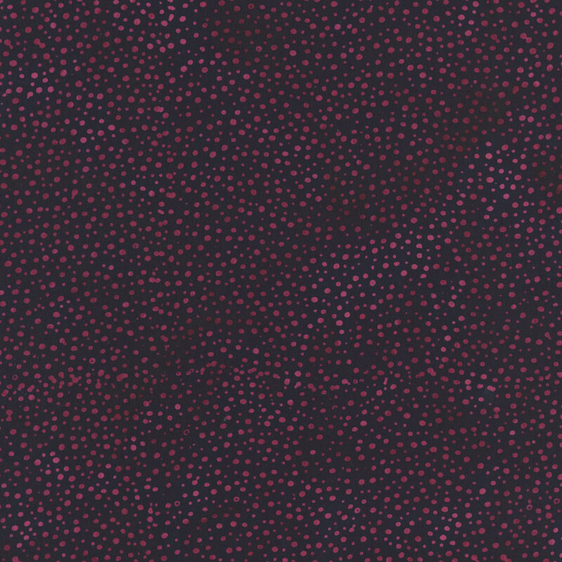 purple fabric with a pattern of violet dots on a mottled background.