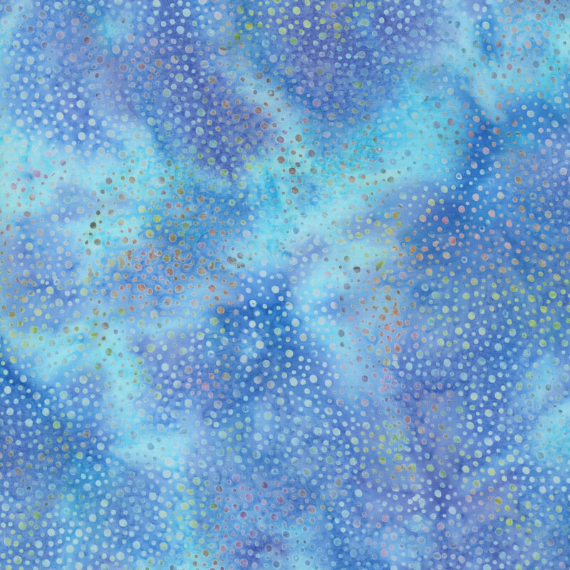 Swatch of cerulean tonal batik with indigo mottling and irregular dots.