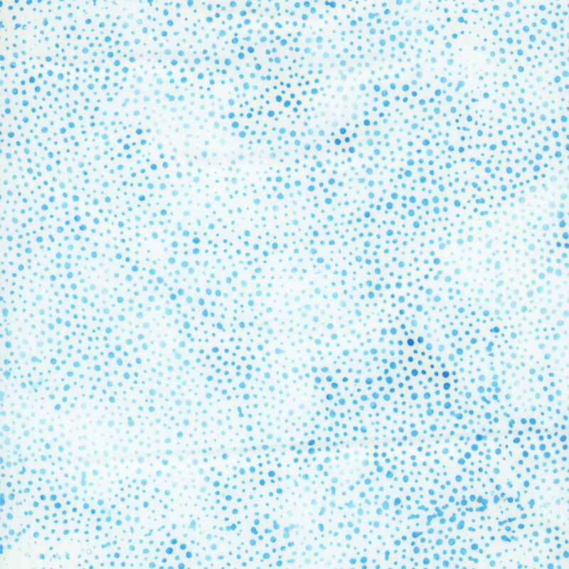white fabric with a pattern of blue dots on a mottled background.